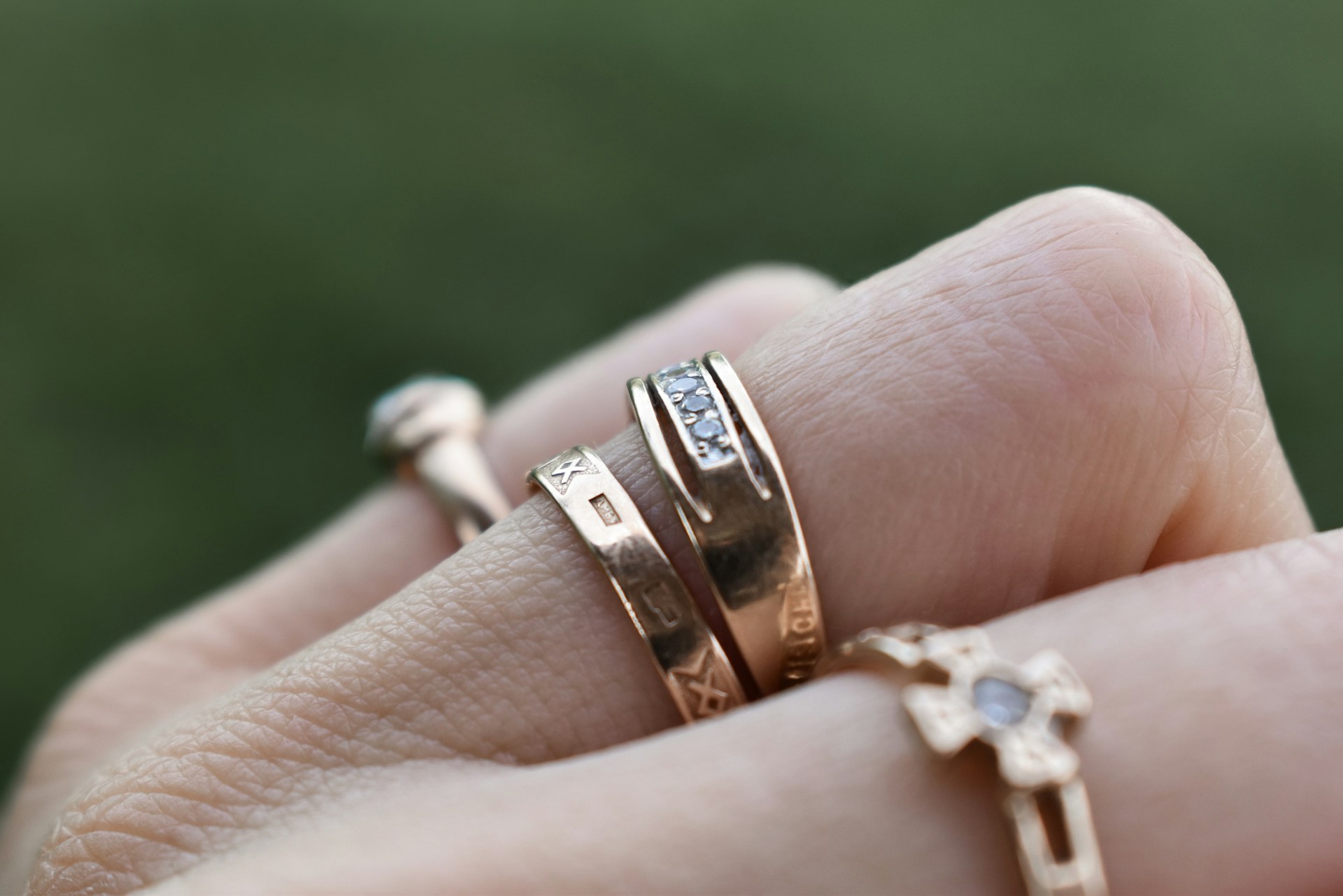 close up of womans hands wearing rings